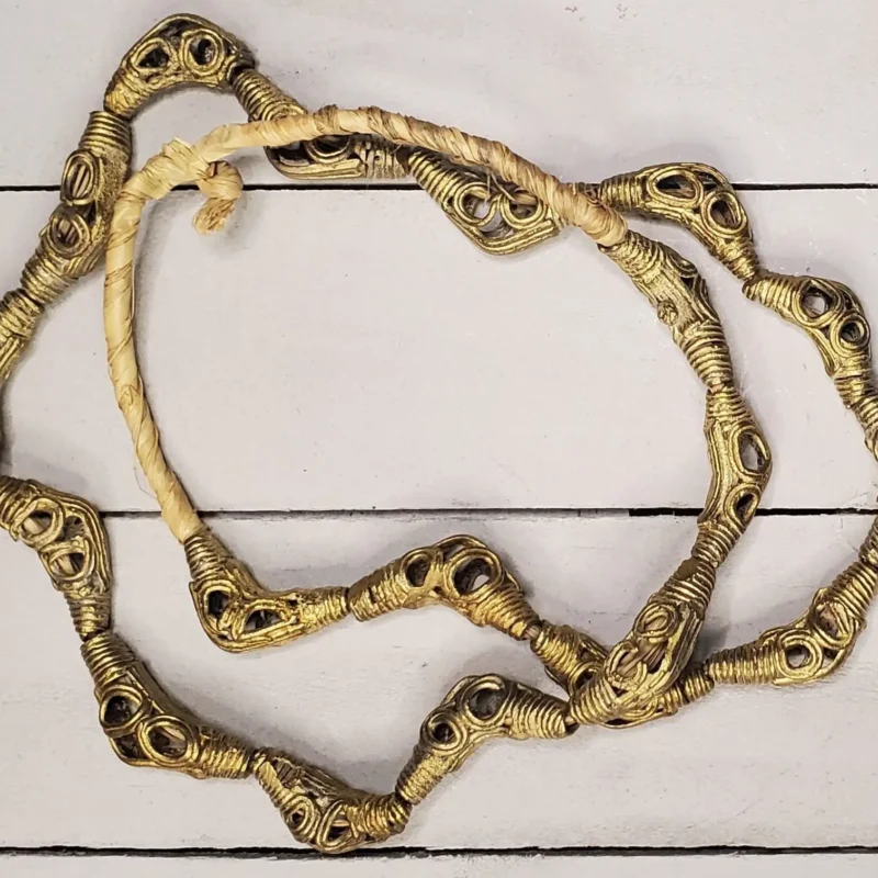 Ghanaian brass beads with crest pattern, hand-cast for traditional and modern jewelry