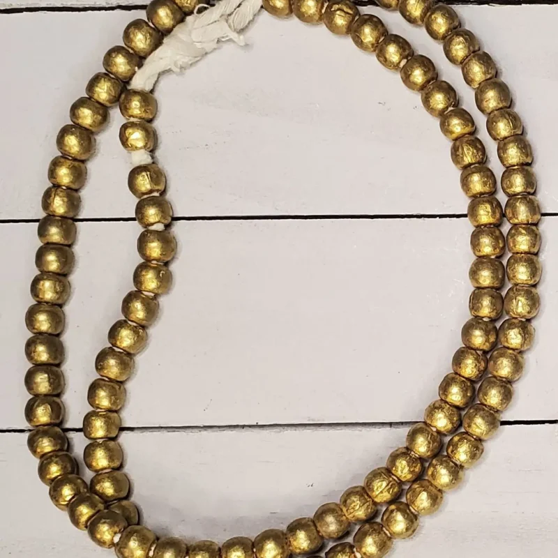 Small Ethiopian brass beads, hand-cast geometric shapes for jewelry-making