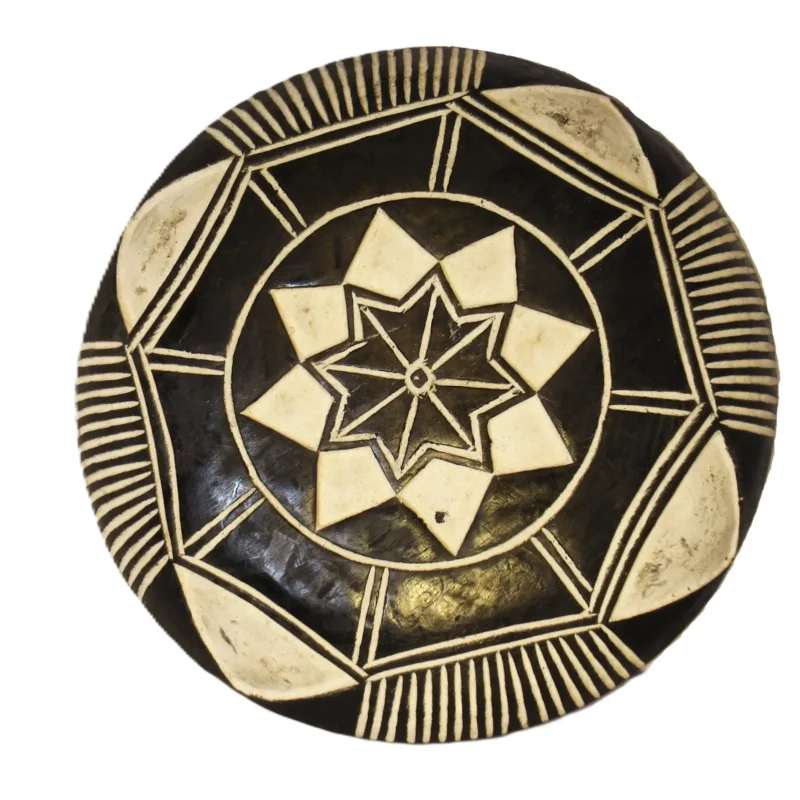 Bamileke wooden shield with flower pattern, hand-carved ceremonial shield from Cameroon
